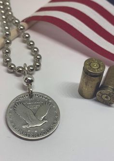 Authentic Silver Standing Liberty Quarter that was minted from 1916 to 1930 in the USA. This coin is featured with the eagle side out and represents freedom. This coin is silver and has a silver topper and a 20 inch stainless ball chain. Handmade in the USA by The Fun Company Jewelry. See more at www.http://Etsy.com/Shop/TheFunCompany. Eagle Necklace, Flying Eagle, Quarter Dollar, Boy Scout, Coin Jewelry, Boy Scouts, Silver Man, Jewelry Projects, Necklace Handmade