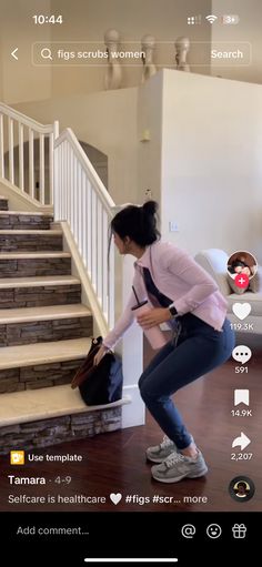 a woman is standing in front of some stairs