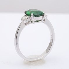 This oval cut Tsavorite Garnet, set at the center of this ring steals the show. It’s rich green, has been highlighted by the perfectly matched round brilliant diamonds that rest on either side of the center stone. Eye clean and large in size, this 2.13 carat stone is a rare gem. Set in 18K white gold, this ring is just the right combination grace and beauty. Order online info@jupitergem.com Tsavorite Garnet, Detailed Ring, Rich Green, Rare Gems, White Gold Ring, Brilliant Diamond, White Gold Rings, Oval Cut, Round Brilliant