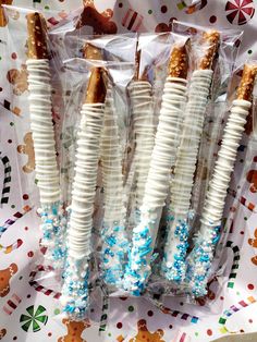 some white and blue candy sticks in plastic bags