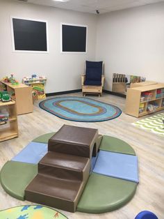 a child's playroom with various toys and furniture