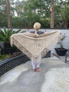 "Gorgeous Flowy Ultra suede shawl, shawl, wrap, Tan, Cream, fringed, Piano scarf, Extra long fringe, Cut out Shawl,  Beautiful large light creamy tan cut out shawl, dancing shawl with long fringe Ultra suede (faux suede) *This is faux suede not real suede  Stitching between the holes is not in our newer shawls. We found they came undone easily. 36\" top to bottom additional 8\" fringe 74\" end to end NKBXF NK727T Gorgeous Flowy Ultra suede shawl, shawl, wrap, Tan, Cream, fringed, Piano scarf, Ex Piano Scarf, Shawl Outfit, Boho Shawl, Glitter Fashion, White Cotton Blouse, Wardrobe Planning, Fringed Poncho, Long Fringe, Long Fringes