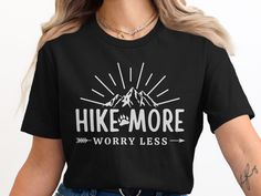 Explore the great outdoors in style with our "Hike More Worry Less" T-shirt. Perfect for hiking enthusiasts and nature lovers. This shirt features a unique mountain and paw print design, making it a thoughtful gift for anyone who loves adventure. Ideal for hikes, outdoor activities, or casual outings. Celebrate your love for nature with this inspiring tee, designed for comfort and style. Product Features: Fabrication: 100% Airlume combed and ring-spun cotton, 32 single 4.2 oz. (Ash - 99% Airlume Hiking Graphic, Mountain Lover, Paw Print Design, Adventure Outfit, Worry Less, Outdoor Apparel, Plein Air, Halloween Shopping, Graphic Tee