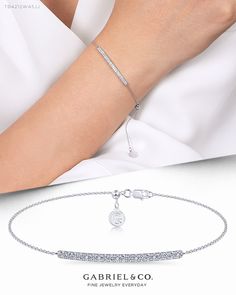 Delicate by design, this diamond bar tennis bracelet is so easy to wear and style. The gently curved bar is enveloped beneath a blanket of shimmering 0.28ct pavé diamonds. Set on a slim 14k white gold chain, this tennis bracelet is an ideal layering piece.  TB4212W45JJ #GabrielNY #DiamondJewelry #FineJewelry #GabrielAndCo #UniqueJewelry #FineJewelry#FashionJewelry#UniqueJewelry#GiftIdeas#UniqueGifts #DiamondJewelry #Jewelry#YellowGold Bangle   #Bangles #Bracelets Luxury Minimalist Diamond Accented Bracelet, Luxury White Gold Chain Bracelet For Parties, Luxury Diamond White Chain Bracelet For Gift, Cheap White Chain Bracelet, Cheap White Chic Bracelets, Cheap Chic White Bracelets, Minimalist Luxury Bracelets With Diamond Accents, Casual White Bracelet, Luxury Minimalist Bracelets With Diamond Accents