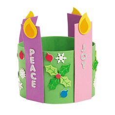 a paper crown with christmas decorations on it