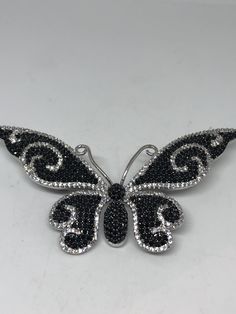 Vintage Black Crystal Gothic Styled Silver Finished Butterfly Broach Vintage casting pin 0ver 1.5 inches ornate Austrian crystal Butterfly with silver finish All jewelry is shipped free in the US in a nice gift box. Check out our over a THOUSAND great reviews Silver Crystal Brooches As Gift, Silver Crystal Brooches For Gift, Silver Butterfly Brooch For Party, Silver Cubic Zirconia Jewelry With Brooch, Black Brooch Jewelry Gift, Black Brooch Jewelry As Gift, Black Brooch Jewelry For Gift, Butterfly Brooch For Evening Wear, Evening Butterfly Brooch Jewelry