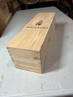 a wooden box sitting on top of a table