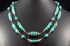 A beautifully carved turquoise barrel is framed by round and oval turquoise beads and southwest-style corrugated rondelle sterling silver beads. This is a double stranded necklace secured by a magnetic clasp with a turquoise nugget. Customers love our magnetic clasps -- so easy to use and ideal for individuals who struggle with fine motor skills.  The turquoise beads on this necklace are dyed and stabilized for durability.  A beautiful complement to these earrings: https://www.etsy.com/listing/1 Yoga Pendant, Multi Gemstone Bracelet, Lapis Lazuli Necklace, Double Strand Necklace, Spiral Earrings, Pretty Jewelry, Southwest Style, Amethyst Necklace, Genuine Turquoise