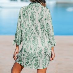 Elevate your beachwear with the Cupshe Sage Floral Button-Up Cover-Up. This elegant piece combines functionality with style, featuring a refreshing sage color adorned with delicate floral motifs. Perfect for layering over your favorite swimwear, it offers a chic and versatile look for any seaside outing.

- Color: Sage
- Material: Lightweight fabric
- Gender: Female
- Age Group: Adult
- Features: Button-up front for easy wear

Ideal for those sun-drenched beach days or a casual poolside retreat, Green Cover-up For Poolside Vacation, Green Long Sleeve Beachwear Swimwear, Green Vacation Cover-up For Poolside, Green Long Sleeve Swimwear For Beach, Green Spring Cover-up For Beach Party, Spring Green Long Sleeve Swimwear, Green Cover-up For Beach Party Vacation, Green Beachy Cover-up For Vacation, Green Beachy Vacation Cover-up