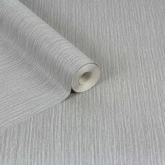 a roll of grey fabric on top of a table