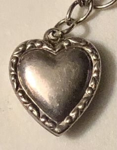 "This is a fabulous mini-collection of sterling silver hearts on a silver bracelet, ready to wear and add on if desired. You are buying FOUR puffy heart charm pendants for ONE price. They are ALL sterling silver and stamped. All of these hearts appear to be older, non-repros, dating to the early 1900s. They are on a 7\" silver (unmarked) charm bracelet and weigh a total of 8.7 grams. In very good vintage used condition, these are all sold as found, unpolished, lovely patina, all original and fre Puffy Heart Charms, Puffy Heart, Sterling Silver Heart, Heart Charm Bracelet, Pocket Watch, Heart Charm, Charm Pendant, Silver Bracelet, Bracelet