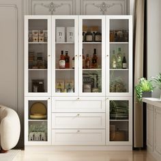 a white cabinet filled with lots of bottles