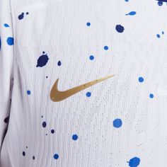 the nike shirt has blue spots on it