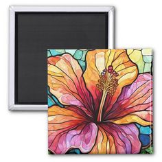 a painting of a colorful flower on a refrigerator magnet