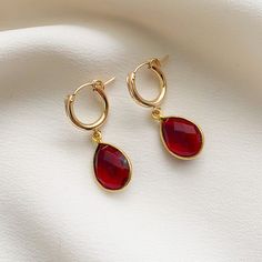 Beautiful garnet pear shape bezel-set gemstones dangle from 14k gold fill click style hoop earrings.  Garnet is the birthstone for January and symbolizes inner force, passion, and love.  These simple earrings make a lovely gift for loved ones born in January or for fans of this beautiful hue. If you are looking for this style in other colors, they are available in gemstones for all the months of the year in my shop.   ✤Hoops: 13mm diameter ✤Gemstone Charms: 18.5x11.5mm Stone diameter: 14 x 10mm Classic Teardrop Earrings With Bezel Setting, Pear-shaped Gemstone Teardrop Earrings For Gift, Pear Shaped Teardrop Gemstone Earrings For Gifts, Pear-shaped Teardrop Gemstone Earrings As Gift, Classic Teardrop Bezel Set Earrings, Pear-shaped Teardrop Gemstone Earrings For Gifts, Elegant Teardrop Bezel Set Earrings, Fine Jewelry Teardrop Pendant Earrings As Gift, Tarnish Resistant Teardrop Pendant Earrings As Gift