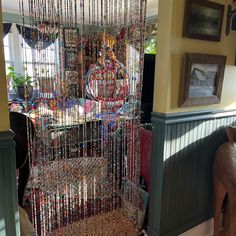 a room with beads hanging from the ceiling