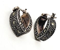 Marcasite Thick Tear Drop vintage sterling silver hoop earrings. Good vintage condition with little signs of normal vintage wear. Stamped 925A on the inside of the hoops. No missing stones. Acid tests positive for sterling silver. Earrings measure 7/8ths of an inch tall, 5/8ths of an inch deep and 5/16ths of an inch wide. Handmade Vintage Hoop Earrings For Anniversary, Vintage Handmade Hoop Earrings For Anniversary, Vintage Pierced Hoop Earrings For Anniversary, Vintage Small Hoop Earrings, Vintage Silver Hoop Jewelry, Vintage Silver Small Hoop Jewelry, Vintage Silver Hoop Earrings, Vintage Small Hoop Silver Jewelry, Vintage Sterling Silver Nickel Free Hoop Earrings