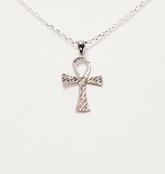 "- Awesome Silver Hammered Ankh Egyptian Christian Cross Pendant, Necklace, in solid textured 925 Sterling Silver with Silver Self-Bail. Chain and Lobster Clasp included. Photos #1-5. - Front of the Cross has Hammered, or Textured \"Cuts\" that give it a lot of sparkle. - Back of the Cross in equally beautiful but has less sparkle. See Photo #5. - Cross measures 1 3/8 x 7/8\" and drops 1 5/8\" from the Chain. Cross is reversible and has different pretty look on the back. - Chain Length 20\". - 9 Sterling Silver Ankh Necklace In Silver, Sterling Silver Ankh Engraved Jewelry, Silver Ankh Hallmarked Jewelry, Hallmarked Silver Ankh Jewelry, Silver Diamond Cut Cross Pendant Necklace, Silver Cross Necklace With Diamond Cut, Silver Ankh Jewelry For Anniversary, Ankh Egyptian, Sand Dollar Pendant