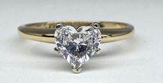 .87 ct Perfectly Shaped Heart Diamond set in a 14k yellow & white gold five prong "tiffany" mounting. Diamond is SI in Clarity and F in Color!! Full Trade Value Applies to the Diamond. Mounting can be upgraded, price varies based on mounting of choice. Stop in to view our wide selection of semi-mounts and/or to discuss custom design with our state of the art CAD Technology Expert Mathew Harris. Heart Diamond Engagement Ring, All My Heart, Heart Diamond, Color Full, With All My Heart, Princess Diamond, Diamond Set, Diamond Heart, State Art