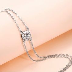 1 Carat Diamond Moissanite Solitaire Dainty Double Chain Adjustable Bracelet Retail Price - $299 Carat Weight - 1 Carat 6.5mm Stone Cut ~ Round Brilliant Color ~ D-E Clarity ~ Vvs1 Adjustable Bracelet ~ 6.5"+2" (16.5cm+5cm) Genuine Moissanite Solid 925 Sterling Silver 18k White Gold (Triple Plating For Extra Durability, Prevents Tarnishing & Adds Shine) Gra Gem Report & Certification Of Authenticity Included! Comes In Gift Box With Jewelry Polishing Cloth Suitable Size For Women And Girls. Comfo Silver Diamond Bracelet With Bezel Setting, Dainty Silver Diamond Bracelet With Bezel Setting, Wedding Diamond Bracelet With Single Diamond, Formal Single Diamond Bracelet Jewelry, Elegant Silver Diamond Bracelet With Bezel Setting, Silver Diamond Bracelet With Bezel Setting For Anniversary, Dainty Silver Diamond Bracelet With Prong Setting, White Gold Diamond Bracelet With Bezel Setting For Wedding, Fine Jewelry Moissanite Diamond Bracelet As A Gift