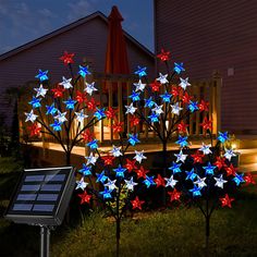 a solar powered tree with red, white and blue stars