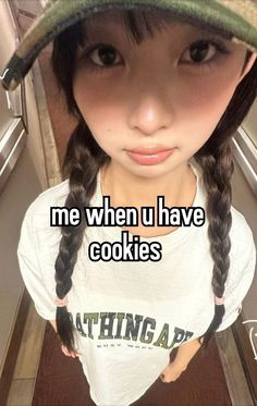 a girl wearing a hat with the words me when u have cookies