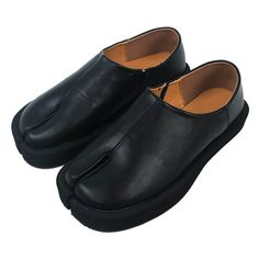 These slip-on leather shoes feature a unique split-toe design. They have a smooth black leather upper with a minimal seam and are set on a flat sole for comfortable, streamlined wear Material: Leather Run small, please review the sizing information Modern Slip-on Leather Shoes With Vibram Sole, Modern Leather Slip-on Shoes With Vibram Sole, Black Slip-on Loafers With Vibram Sole, Modern Black Slip-ons With Stitched Sole, Y2k Black Aesthetic, Y2k Blue Aesthetic, Fur Boots Outfit, Y2k Fashion Outfit, Fall Outfits Y2k