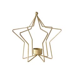 a gold metal star decoration with a candle holder