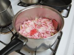 a pot filled with food sitting on top of a stove