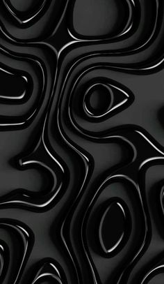 an abstract black and white background with wavy, curved lines in the center on top of each other