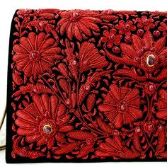 "Stunningly beautiful, opulent OOAK statement black velvet clutch hand embroidered with metallic cherry red flowers and embellished with genuine star rubies to create an opulent, 3D effect. This is an exclusive piece, a gorgeous wardrobe investment piece! The exquisite embroidery and the remarkable number of star rubies transforms this velvet clutch in to a TRUE statement piece! The best word to describe this purse is \"regal\". Hand embroidered in meticulous detail by the most skilled artisans Embroidered Evening Bag For Festivals, Elegant Hand Embellished Shoulder Bag For Evening, Designer Embroidered Evening Bag, Red Rectangular Evening Bag For Festivals, Red Embellished Shoulder Bag For Formal Occasions, Designer Festival Evening Bag, Designer Evening Bag For Festivals, Formal Hand Embellished Shoulder Bag, Red Rectangular Clutch With Handwork