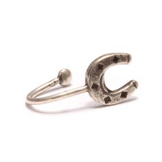 Size & Dimensions: Width of the horseshoe: approx. 6 mm (0.24 inch) Height of the horseshoe: approx. 6 mm (0.24 inch) Material: 925/- sterling silver, oxidized It's beautiful and I want to have it! only... What is it? Throwing a horseshoe over your left shoulder is supposed to bring good luck. Now you could think - maybe it brings much more luck if you just wear the horseshoe on your left ear instead? Well, it would be worth a try ;) This ear clip is made of genuine 925 sterling silver and the s Adjustable Silver Clip-on Cartilage Earrings, Adjustable Nickel-free Silver Piercings, Adjustable Clip-on Sterling Silver Jewelry, Silver Clip-on Cartilage Earrings As Gift, Silver Clip-on Cartilage Earrings For Gift, Silver Adjustable Horseshoe Rings, Adjustable Sterling Silver Clip-on Earrings, Adjustable Sterling Silver Nose Rings For Gift, Adjustable Silver Nose Rings For Gift