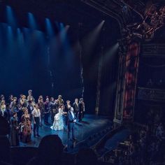 a group of people standing on top of a stage