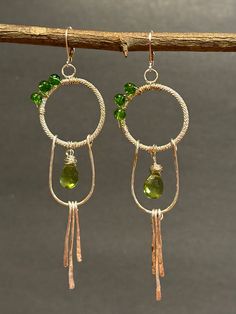 Artisan designed and handmade earrings faceted Peridot Teardrop briolette gems, I formed the hoop, twisted Sterling Silver, the half hoop and the silver dangles. These earrings are hoop dangle chandelier Earrings.  There are three tiers, forged twisted hoop wire wrapped peridot beads, forged hammered half hoop, wire wrapped teardrop briolette dangling and three forged hammered silver wire dangles.  Total measurement, length 4 inches long including sterling silver lever back earring wire, width 1 Chandelier Earrings Diy, Hoop Chandelier, Earring Wire, Diy Earring, Family Jewels, Earring Ideas, Handmade Wire Jewelry, Handmade Wire, Gift Jewelry