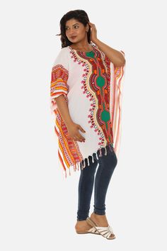 Introducing the Stunning White Caftan made from soft and breathable cotton base, adorned with a striking multi-colored tribal print and finished off with playful tassels. This bohemian-inspired caftan is the perfect addition to your summer wardrobe, offering comfort and style all in one. Bohemian Multicolor Poncho For Festival, Beach Poncho With Fringe In Multicolor, Beach Multicolor Poncho With Fringe, Beach Poncho With Multicolor Fringe, Multicolor Fringe Poncho For Beach, Multicolor Spring Kaftan With Back Tassel Tie-up, Bohemian Colorful Poncho For Festival, Multicolor Fringe Poncho For The Beach, Traditional Multicolor Tunic For Festivals