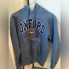 Never Worn, Like New Oxford University Hoodie Thick And Very Nice Quality Official Merchandise Quality Embroidery Oxford University Sweatshirt, Blue Cotton Hoodie With Embroidered Logo, Blue Hoodie With Embroidered Logo, Blue Hoodie With Embroidered Logo For Winter, Winter Blue Hoodie With Embroidered Logo, Blue Long Sleeve Sweatshirt With Embroidered Logo, Blue Crew Neck Hoodie With Embroidered Logo, Blue Winter Sweatshirt With Embroidered Logo, Winter Blue Sweatshirt With Embroidered Logo