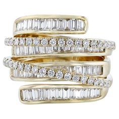 This ring is made in 18 Karat Yellow Gold. It features 40 round cut, prong set diamonds weighing 0.49 carats. Along with 62 tapered baguette cut, channel set diamonds weighing 1.39 carats. With a color grade (H) and clarity grade (SI2).