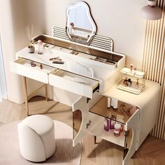 a white dressing table with a mirror and stool in front of it on the floor