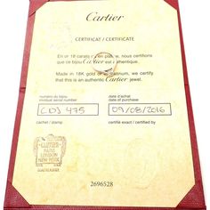 an award certificate is displayed on a white surface with red trimming and gold foil