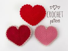 two crocheted hearts sitting next to each other