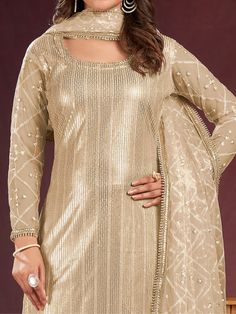 Introducing a charming beige net kameez adorned with delicate threadwork, sequin detailing, and fancy readymade lace border, creating an ensemble that exudes elegance. Paired seamlessly with a crepe salwar in a matching beige shade, this outfit is a perfect blend of sophistication and style.
Completing the ensemble is a net dupatta in a similar beige color, featuring sequin work, thread embroidery, and a fancy lace border.
The beige salwar kameez comes as an un-stitched material, accommodating s Festive Beige Georgette Lehenga, Beige Semi-stitched Sharara For Eid, Fitted Beige Georgette Set, Gold Floor-length Unstitched Suit With Zari Work, Semi-stitched Floor-length Gold Churidar, Gold Floor-length Unstitched Suit With Resham Embroidery, Gold Unstitched Floor-length Suit With Resham Embroidery, Gold Unstitched Suit With Resham Embroidery Floor-length, Gold Fitted Anarkali Churidar