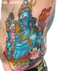 a man with a tattoo on his stomach