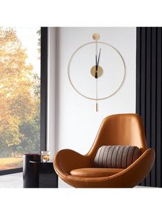 an egg chair in front of a window with a clock on the wall