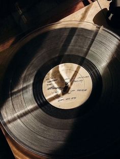 an old vinyl record with writing on it