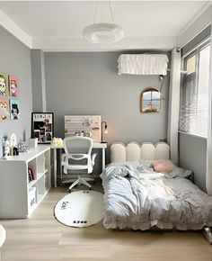 a bedroom with a bed and desk in it