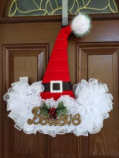 a door hanger with a santa hat on it