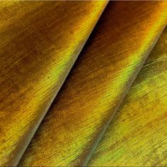 close up image of yellow and green fabric