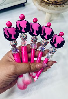 All orders of $35 or more ship for free! Transform your beauty routine with our stunning set of Barbie-themed synthetic beaded makeup brushes. Each brush features a rose pink body adorned with coordinating beads and a silicone bead bearing the silhouette of Barbie's likeness. Elevate your makeup experience with this chic and stylish set that's not only functional but also a delightful tribute to an iconic fashion icon. Bead Makeup, Beaded Makeup, Makeup Brushes Set, Pink Body, Iconic Fashion, Fashion Icon, Beauty Routine, Makeup Tools Brushes, Silicone Beads