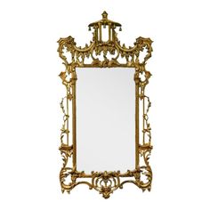 an ornate gold framed mirror on a white background