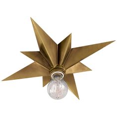 a ceiling fan with a light bulb attached to it's center star shaped blade